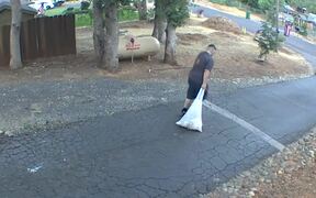 Man With Trash Plastic Bag Accidentally Spills It