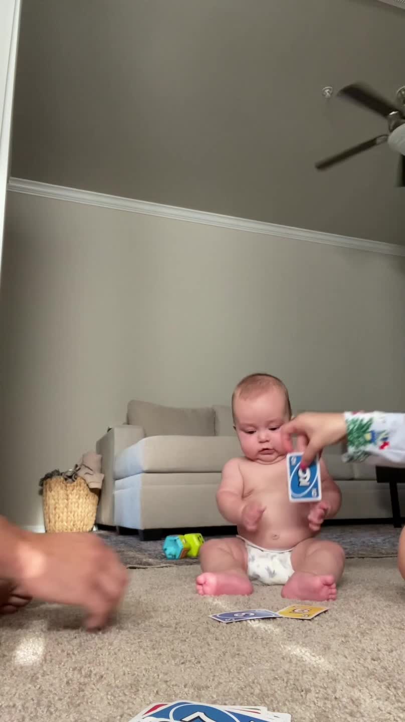 Baby Wins While Playing Card Game With Parents
