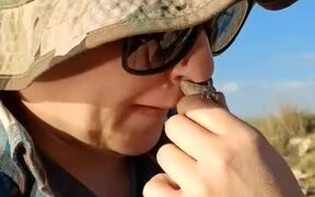 Lizard Bites and Clings to Woman's Nose