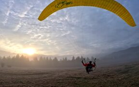 Guy Enjoys Surreal Views While Motor Paragliding