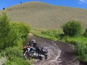 Rider Falls Off Motorcycle During Water Crossing