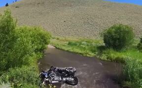 Rider Falls Off Motorcycle During Water Crossing