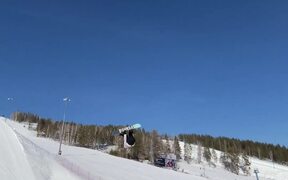Person Attempts Snowboard Trick and Fails