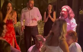 Bride Sitting in Chair Falls When People Lift It 