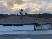 Skateboarder Successfully Executes Roof Jump Trick