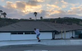 Skateboarder Successfully Executes Roof Jump Trick