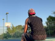 Man Stationed at Bench Shoots Balls Into Basket 