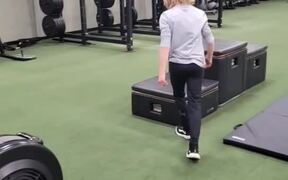 Young Boy at Gym Does Several Backflips Off Boxes