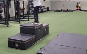 Young Boy at Gym Does Several Backflips Off Boxes