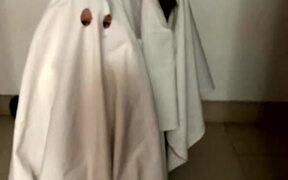 Dog and Baby Dress Up as Ghosts in Sheet