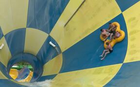 Guy Falls Off Cloverleaf Tube in Middle of a Slide