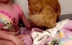 Little Girl Brings Chicken to Her Bed