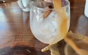 Person Spills Drink While Pouring it