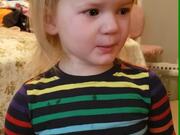 Crying Toddler Pretends to Smile in Front of Mom
