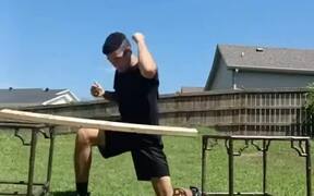 Guy Tries to Break Wooden Plank