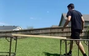 Guy Tries to Break Wooden Plank