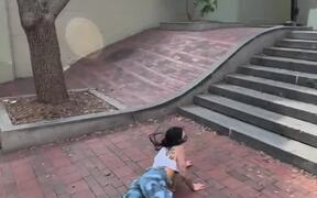 Skater Attempting Jump Trick on Stairs Falls