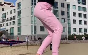 Woman Performs Bouncing Tricks on Slackline