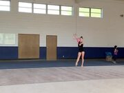 Girl Performs Ballot While Doing Gymnastics