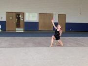 Girl Performs Ballot While Doing Gymnastics