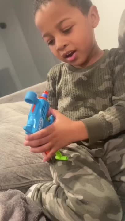 Little Boy Hits Himself While Playing With Gun