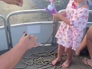 Little Girl is Excited to Catch Her First Fish
