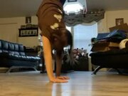 Girl Practicing Handstands in Room Falls Down