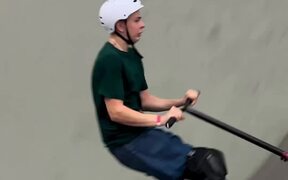 Person Hits Their Own Helmet With Scooter