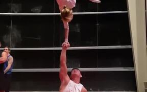 Girl Flawlessly Executes Mid-Air One Arm Handstand