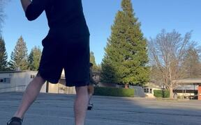 Guy on BalanceBoard Plays Catch With Skateboarder