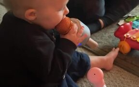 Toddler Sings Into Microphone