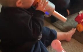 Toddler Sings Into Microphone