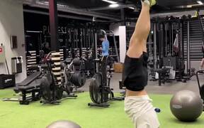 Guy Does Funny Dance at Gym After Doing Handstand