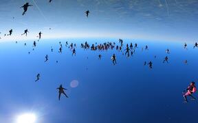 Large Group of People Sky Dive Together