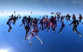 Large Group of People Sky Dive Together
