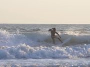 Tracking Shot of a Man Surfing in the Sea