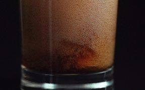 Pouring Cola in Macro View - Slow Motion