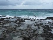 A Choppy Sea Crashing Onto Rocks
