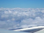 Airplane flying thru beautiful clouds