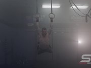 Male Gymnast Practicing on Still Rings