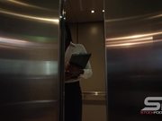 Elevator Door Opens and Woman Walks Out