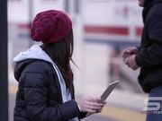 Woman Has Interaction with Person Walking By
