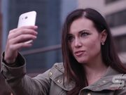 Woman Taking Picture of Herself with Smartphone