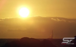 Static View of Sailboat on the Horizon at Sunset - Fun - VIDEOTIME.COM