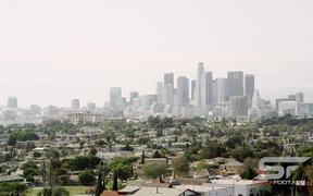 Panning View of Los Angeles with a Smoggy Sky - Fun - VIDEOTIME.COM