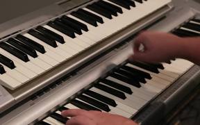 A Musician Plays a Piano and Key Board - Tech - VIDEOTIME.COM
