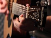 Acoustic Guitar Player in Studio Close Up
