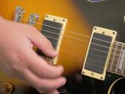 Fingers Picking a Guitar Close Up in HD