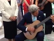 Secretary Kerry Plays Musician's Guitar