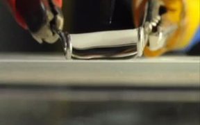 Knife Cutting Water Droplet in Half - Tech - VIDEOTIME.COM